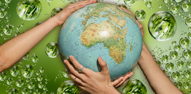 Green drops and hands holding a globe