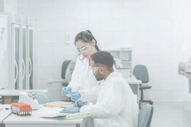 A woman and a man are working together in a lab