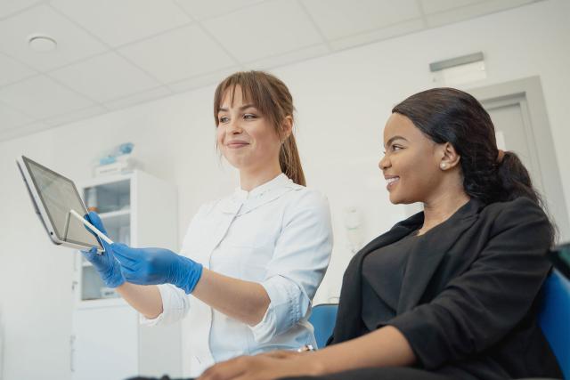 Woman talking to female doctor