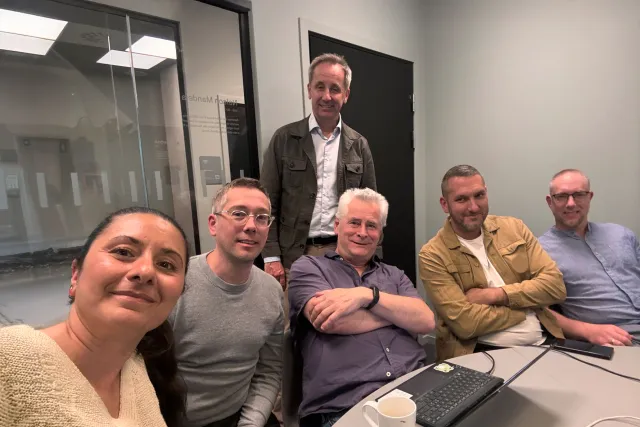 Photo of people around a table