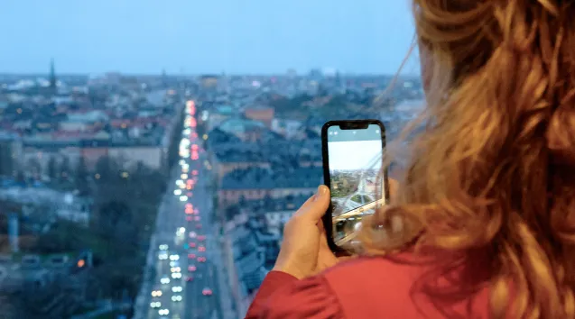 Photo of woman taking a photo