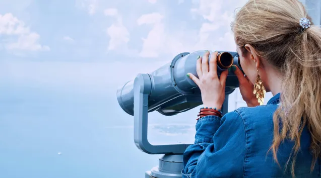 Photo of woman with binoculars