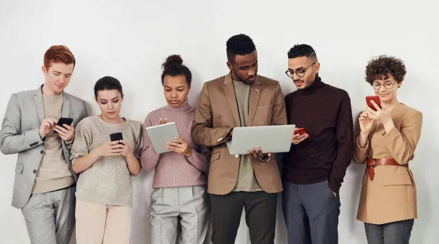 Group of people reading on screens