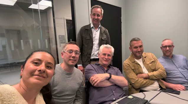 Photo of people around a table
