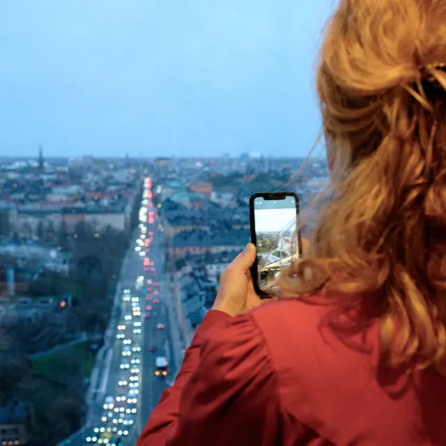 Photo of woman taking a photo