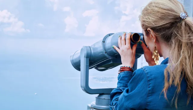 Photo of woman with binoculars