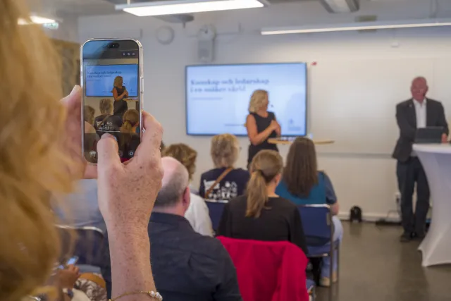 Photo of hand taking a photo